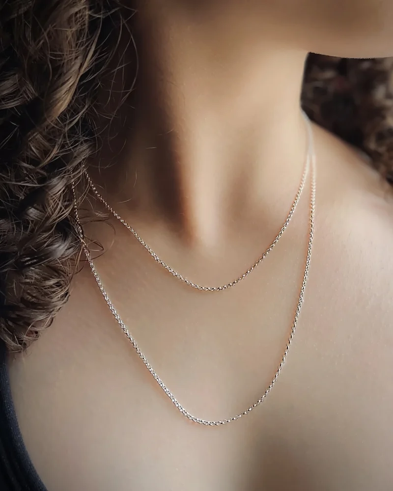 Two fine rolo chains worn together, at 40 and 50 cm